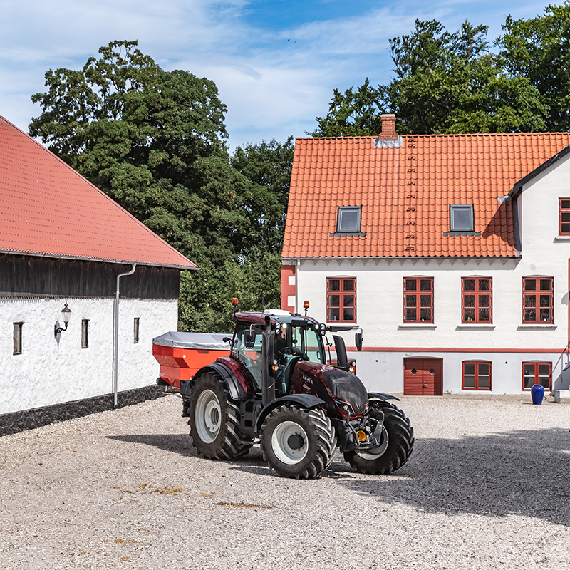 two valtra n4 series tractors working with frontloader