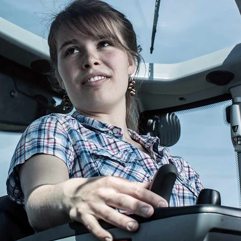 a girl inside valtra n4 series cabin