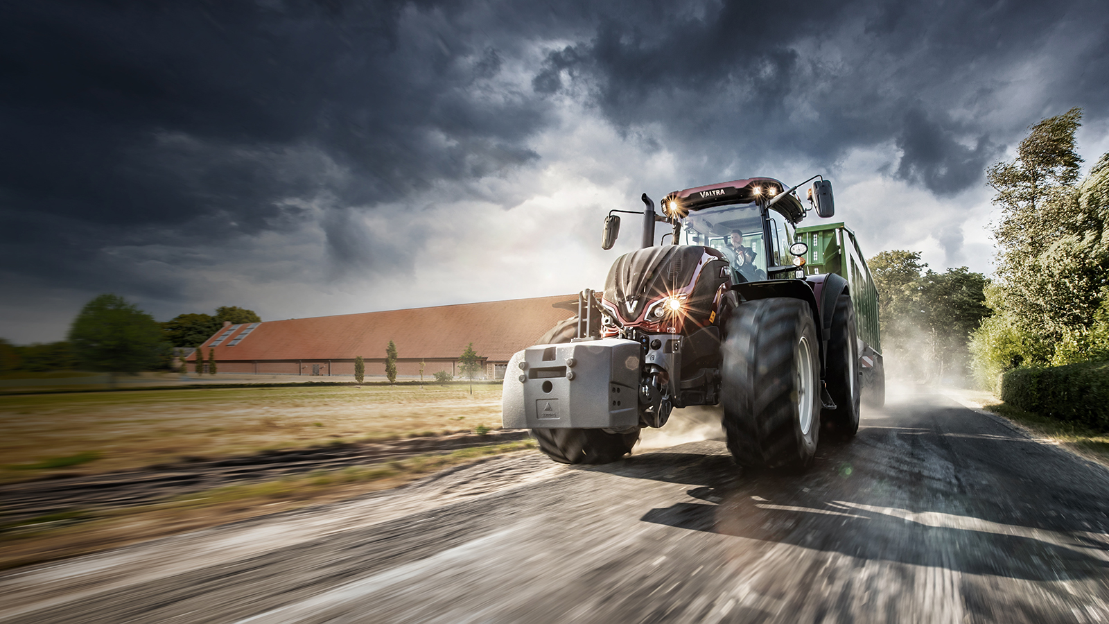 Valtra S Series red driving on the road